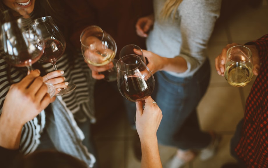 Guests raising glasses in a celebratory toast