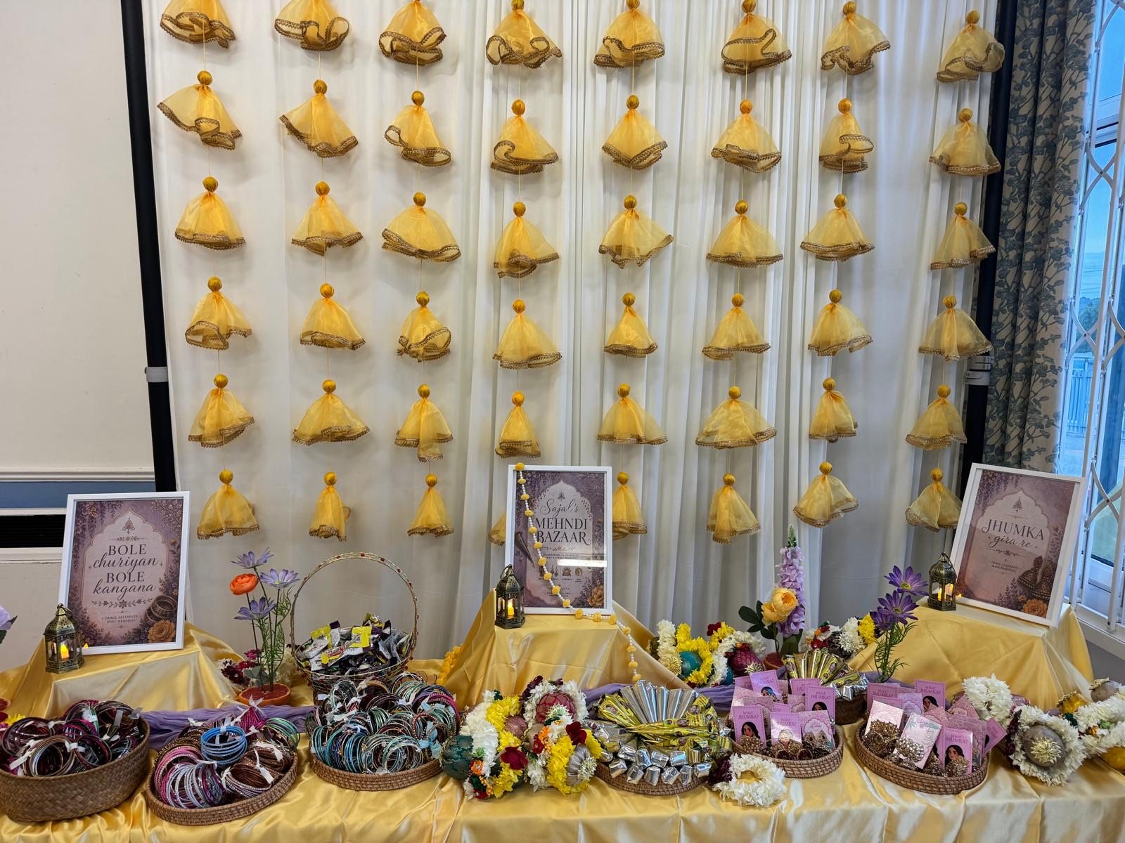 Mehndi Bazaar favour table lined with baskets of colourful bangles and keepsakes
